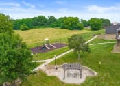 Thumbnail 20 of 27 - a rendering of a park with trees and a playground