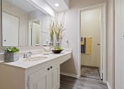 Thumbnail 11 of 27 - a bathroom with a sink and a mirror
