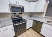 Thumbnail 1 of 26 - kitchen with lots of storage space and upgraded appliances