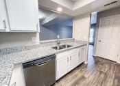 Thumbnail 2 of 26 - Kitchen with window overlooking the living room 