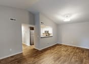 Thumbnail 4 of 35 - A room with wood flooring and a white ceiling.