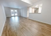 Thumbnail 4 of 26 - wood-style flooring in spacious living room at the plaza at lamberton 