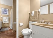 Thumbnail 8 of 31 - a bathroom with a toilet and a sink and a shower