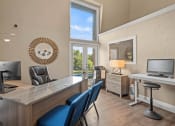Thumbnail 17 of 31 - a home office with a desk and a window