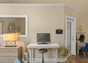 Thumbnail 19 of 31 - a home office with a computer on a desk
