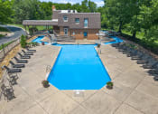 Thumbnail 22 of 31 - an aerial view of a swimming pool with a house in the background