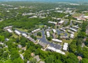 Thumbnail 26 of 31 - an aerial view of a city with buildings and trees