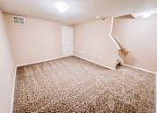 Thumbnail 9 of 39 - an empty room with carpeted floors and a white door