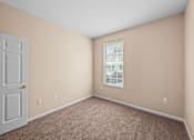 Thumbnail 22 of 39 - Carpeted Apartment Bedroom