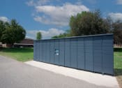 Thumbnail 16 of 28 - a large blue metal building with a sign on the side of it