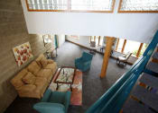 Thumbnail 15 of 28 - a living room with a couch chairs and a table