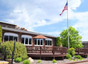 Thumbnail 26 of 28 - a building with an american flag in front of it