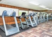 Thumbnail 9 of 28 - a row of treadmills and elliptical trainers in a fitness room
