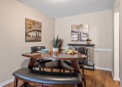Thumbnail 5 of 27 - a dining room with a table and chairs in front of a fireplace