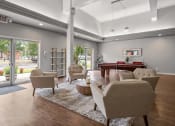 Thumbnail 25 of 27 - a living room filled with furniture and a pool table