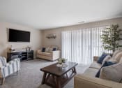 Thumbnail 1 of 27 - a living room filled with furniture and a flat screen tv