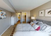 Thumbnail 6 of 20 - a bedroom with a bed and a ceiling with circles on it