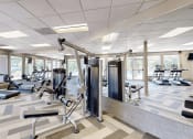 Thumbnail 11 of 20 - apartment gym with weights and other exercise equipment