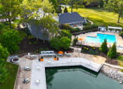 Thumbnail 15 of 20 - clubhouse with pool and lakeview