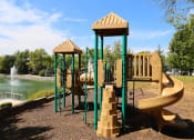 Thumbnail 18 of 20 - a playground with a swing set and slides