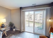 Thumbnail 2 of 20 - apartment living room with sliding glass doors to a balcony