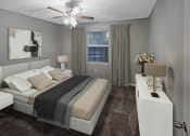Thumbnail 3 of 22 - a bedroom with a bed and a ceiling fan