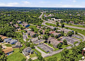 Thumbnail 35 of 35 - A bird's eye view of a residential area with houses and a parking lot.