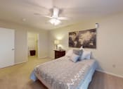 Thumbnail 4 of 15 - a bedroom with a ceiling fan