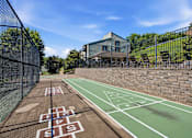 Thumbnail 25 of 35 - A tennis court with the numbers 18 and 19 painted on it.