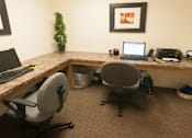 Thumbnail 15 of 23 - a desk with two chairs and a laptop computer