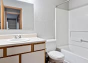 Thumbnail 12 of 23 - apartment bathroom with a sink, toilet and a tub