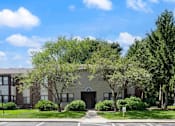 Thumbnail 20 of 23 - apartment building with shade trees and off street parking
