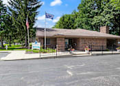 Thumbnail 22 of 23 - a brick leasing office at Valley Stream Apartments