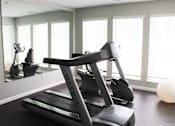 Thumbnail 9 of 22 - gym with a treadmill at apartment complex