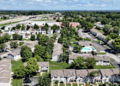 Thumbnail 35 of 35 - A bird's eye view of a residential area with houses, trees, and a pool.