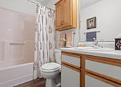 Thumbnail 13 of 23 - a bathroom with a sink toilet and a shower
