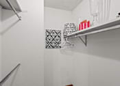 Thumbnail 12 of 23 - a white bathroom with a shelf in the wall