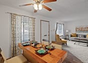 Thumbnail 2 of 23 - entry way to a home with a dining room and living room in the background