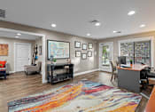 Thumbnail 20 of 23 - a home office with a desk and a rug