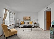 Thumbnail 1 of 23 - a living room with a couch and a table