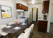 Thumbnail 2 of 15 - connected living and dining area at west broadway apartments