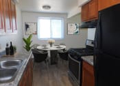 Thumbnail 4 of 15 - Dining Room with Natural Light at West Broadway Apartments