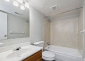 Thumbnail 7 of 12 - a bathroom with a sink toilet and a tub