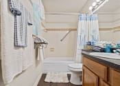 Thumbnail 12 of 31 - apartment bathroom with a shower tub
