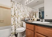 Thumbnail 6 of 31 - bathroom with a sink, toilet and a shower tub