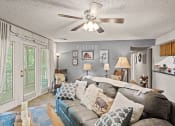 Thumbnail 1 of 31 - apartment living room with a couch and a ceiling fan