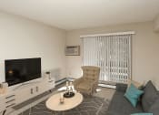 Thumbnail 3 of 13 - Living area with sliding glass door and balcony