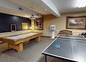 Thumbnail 24 of 27 - A room with a pool table and a ping pong table.