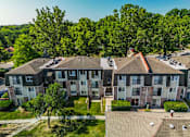 Thumbnail 25 of 26 - an aerial view of a large apartment complex with trees in the background