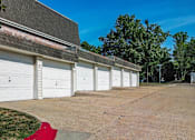 Thumbnail 18 of 26 - a row of garages in front of a building